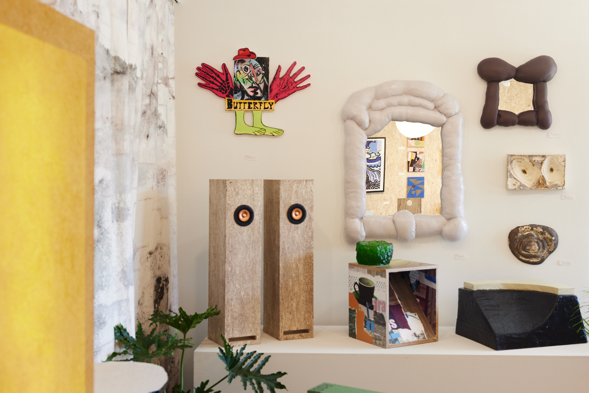 Wilder installation with mirrors, speakers, sculptural furniture, and wall pieces
