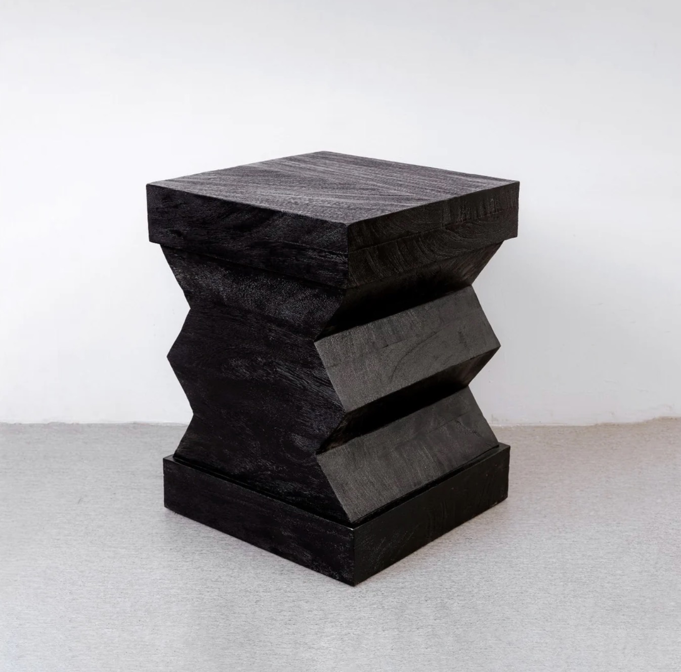 Black sculptural zig-zag wood object