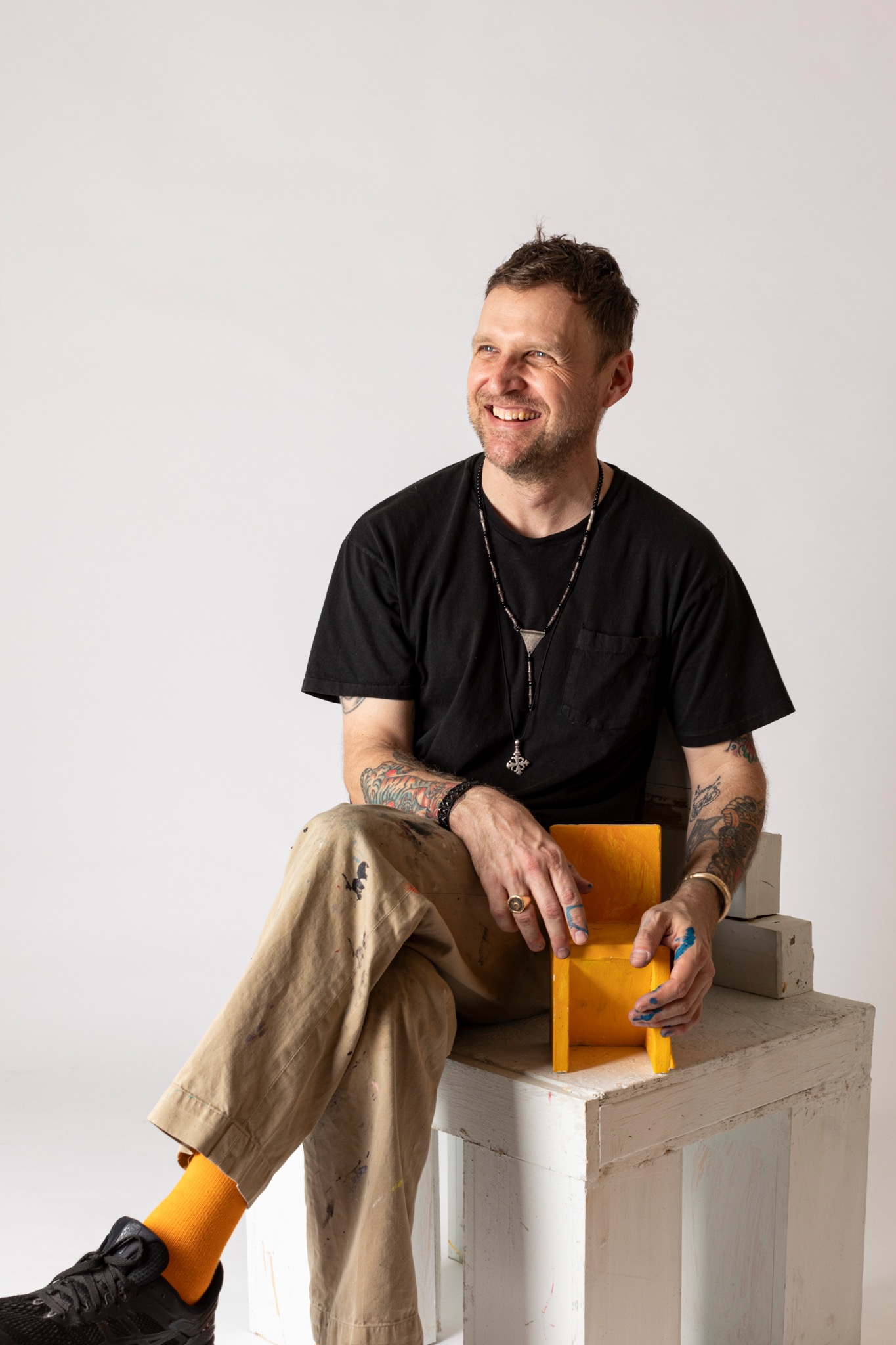 Josh Elrod seated in his studio